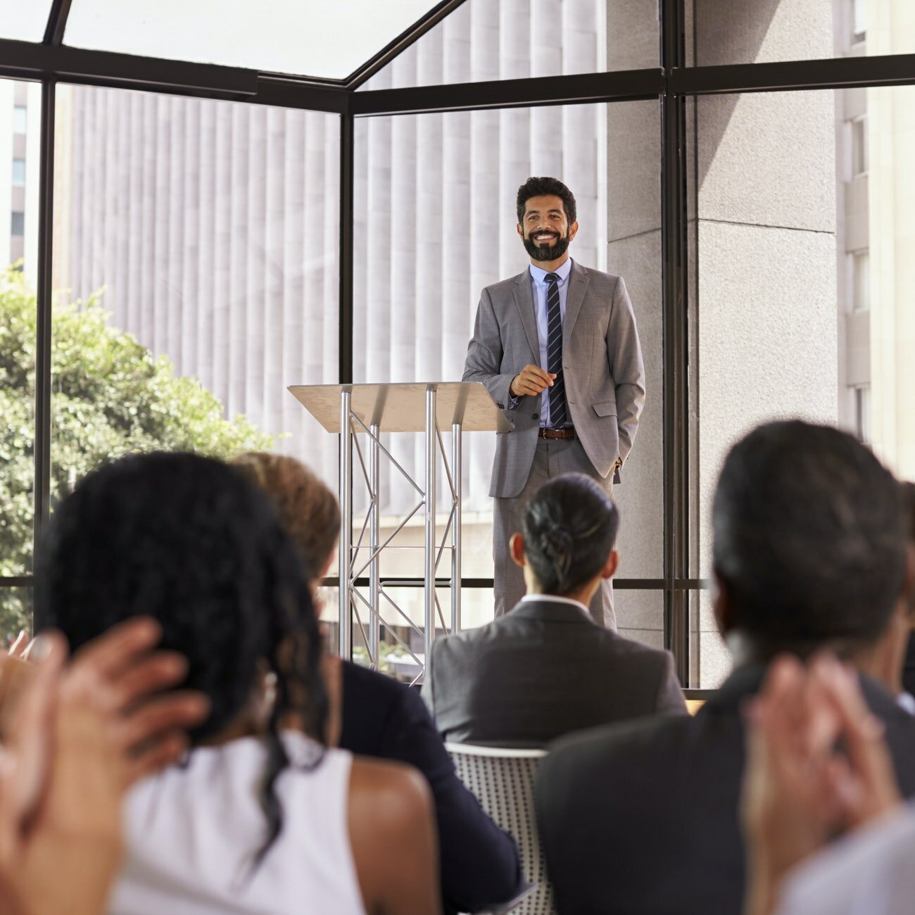 Audience applauding speaker at a business seminar